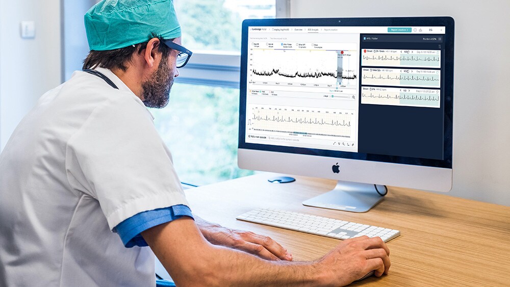 A cardiologist monitoring patient data